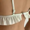Купальник з рюшами молочний